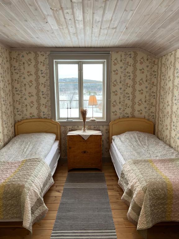 Voodi või voodid majutusasutuse Chinova Mötesgård i Järvsö toas
