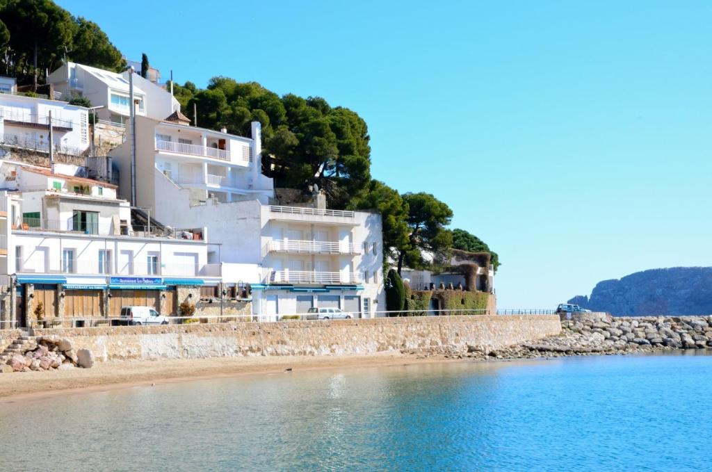 a view of a beach with white buildings at Treputxell 1-1 in L'Estartit