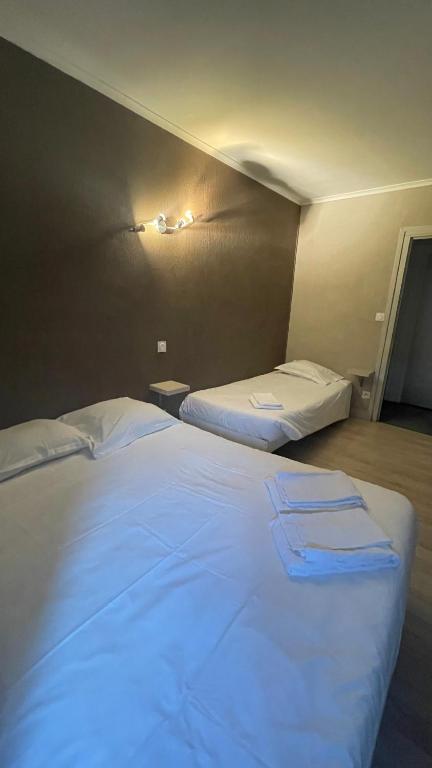 Postel nebo postele na pokoji v ubytování L'Excess Hotel