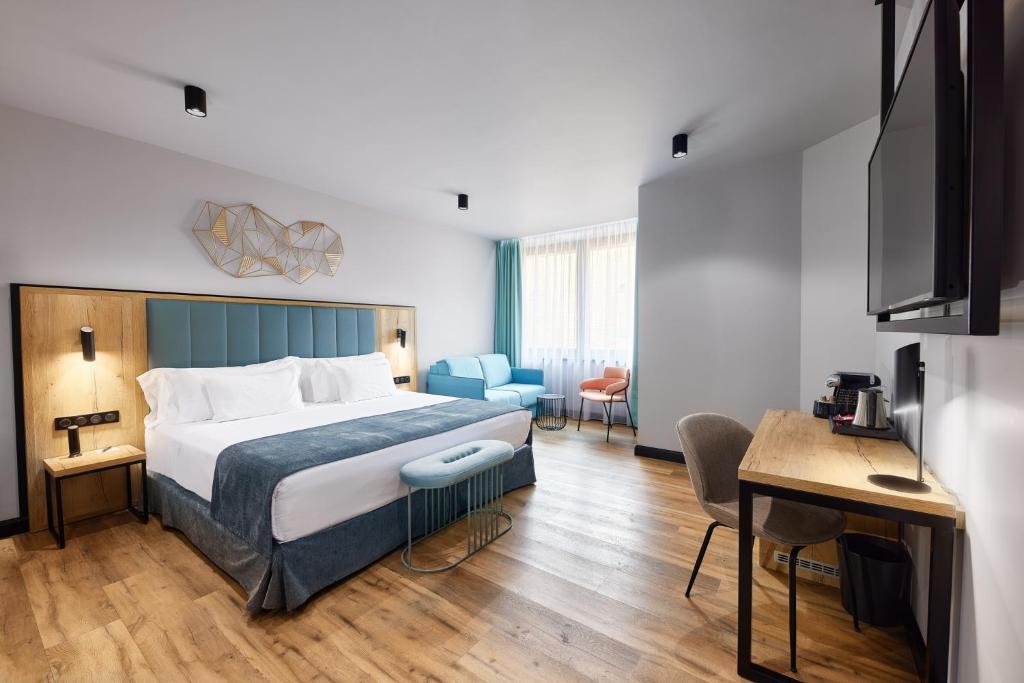 A bed or beds in a room at Barceló Budapest