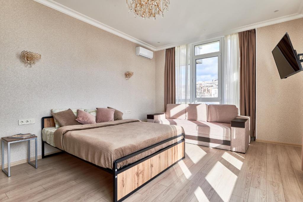 Postel nebo postele na pokoji v ubytování KADOR HOME HOTEL downtown