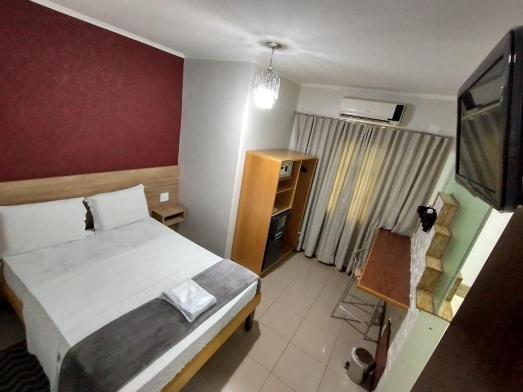 Postel nebo postele na pokoji v ubytování Hotel Cidade