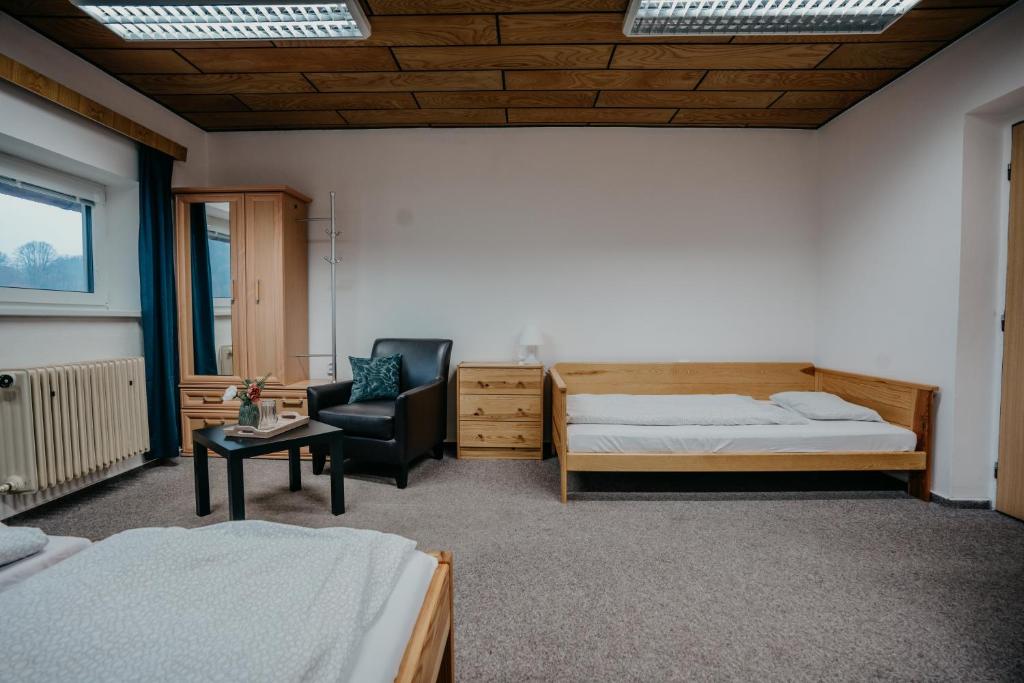 Postel nebo postele na pokoji v ubytování U Ztraceného potoka