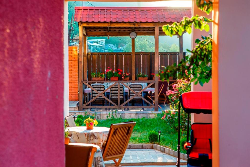 a view of a patio with a table and chairs at Hotel Victoria-Panorama in Borjomi