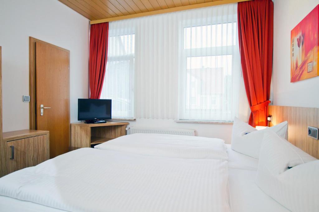 Postel nebo postele na pokoji v ubytování Hotel Schaper
