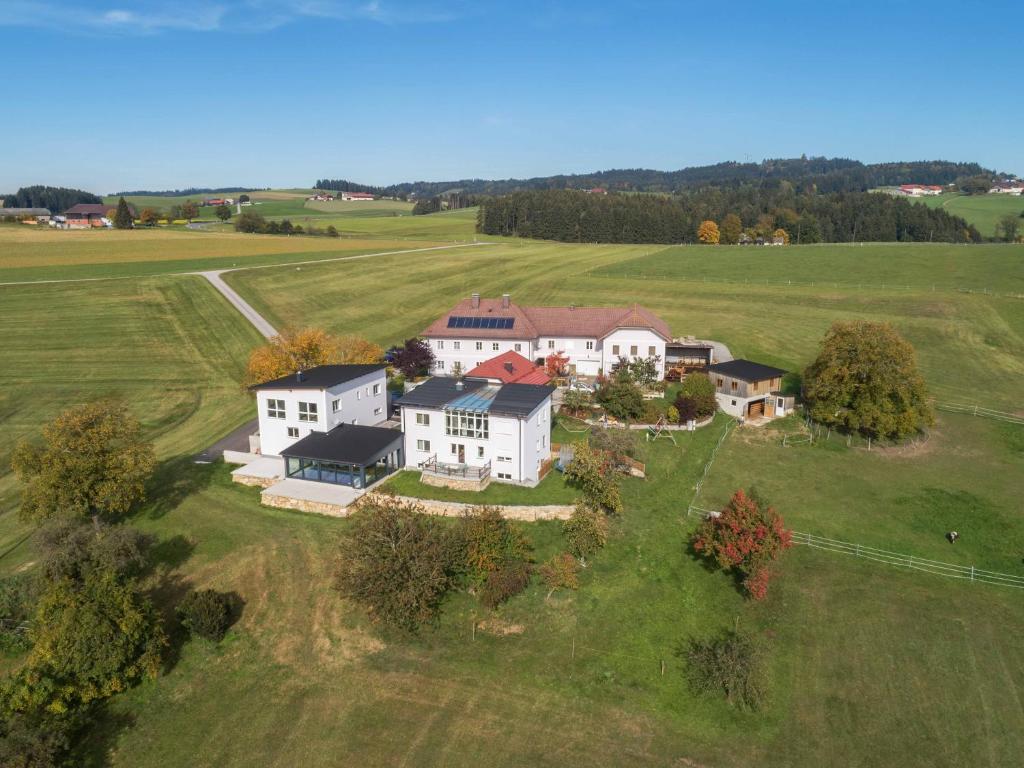an aerial view of a large house in a field at Ferienhof Neundlinger in Niederwaldkirchen