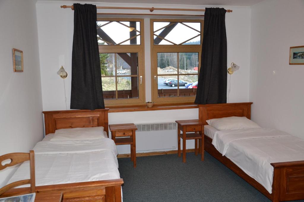 Postel nebo postele na pokoji v ubytování Hotel Modrava