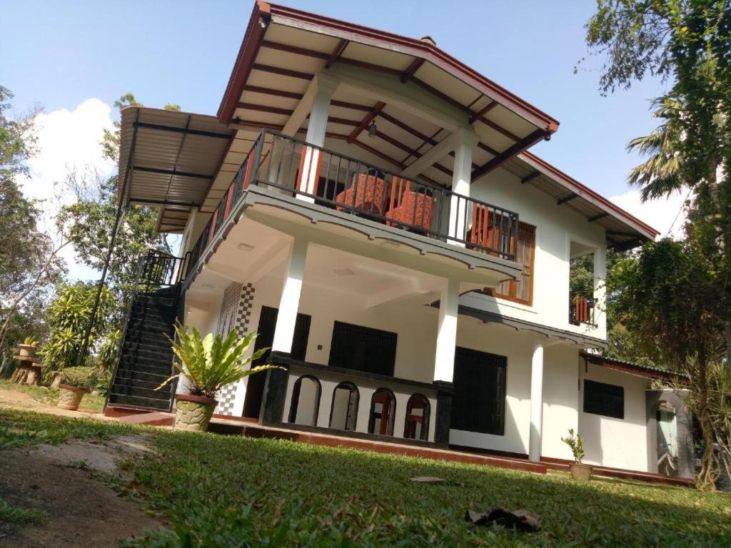 a house with a balcony on top of it at Miyonra - Anuradhapura in Anuradhapura