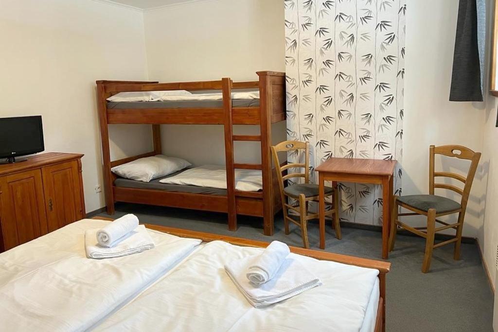 Postel nebo postele na pokoji v ubytování Hotel Modrava