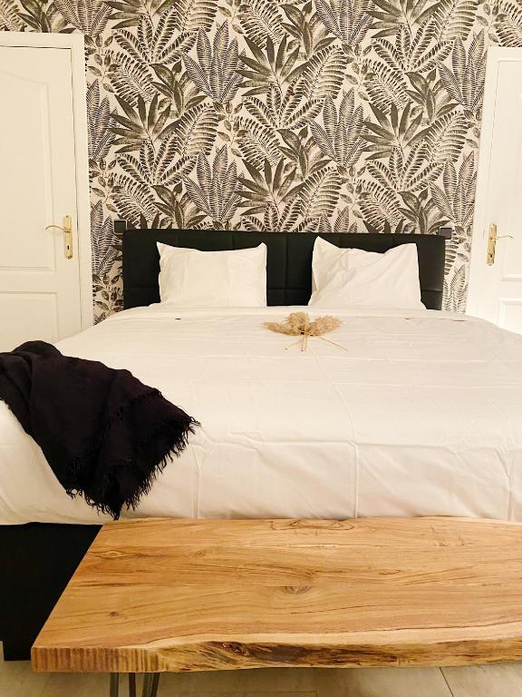 Letto o letti in una camera di Le Pact - Gîte familial