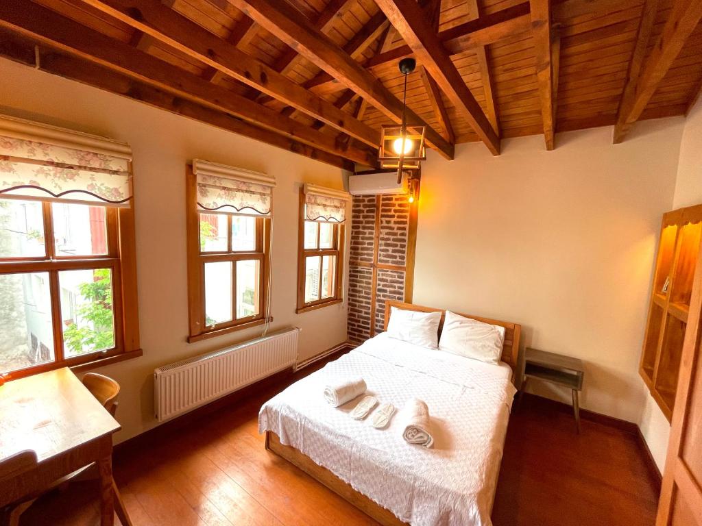 A bed or beds in a room at Authentic Turkish Home Suite