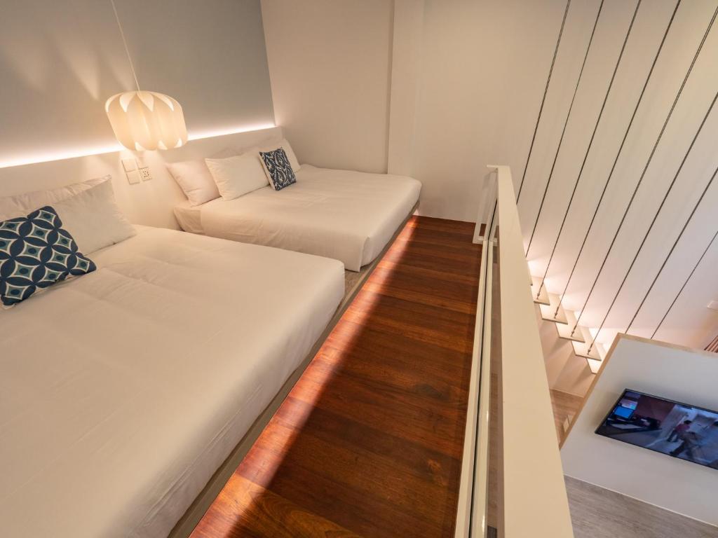 Postel nebo postele na pokoji v ubytování Ease Me Residence