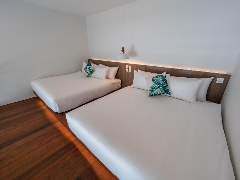 Postel nebo postele na pokoji v ubytování Ease Me Residence