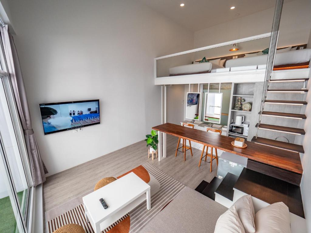 TV a/nebo společenská místnost v ubytování Ease Me Residence