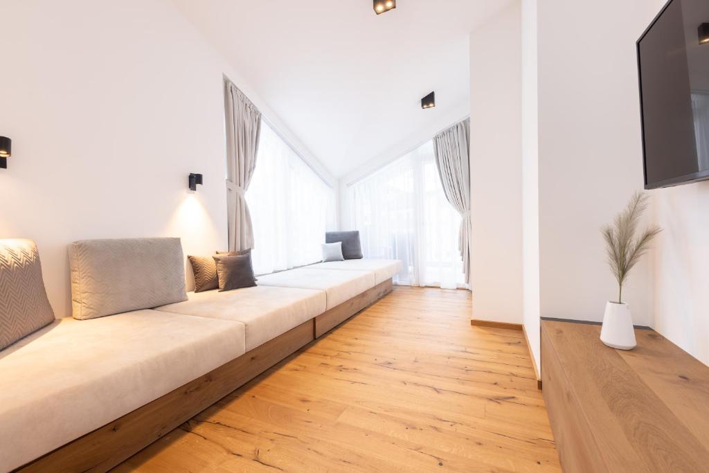 Televízia a/alebo spoločenská miestnosť v ubytovaní Max Mountain Apartments