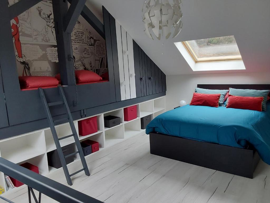 a bedroom with a bunk bed and a ladder at Au Paradis du Loft Joyeux in Willer-sur-Thur