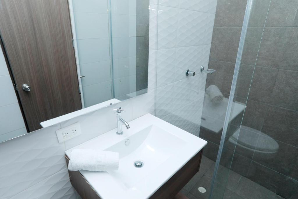 Koupelna v ubytování HOTEL MELGAR PLAZA