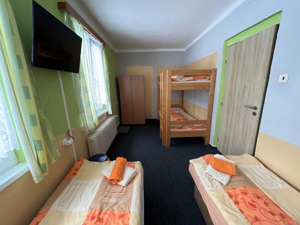 Postel nebo postele na pokoji v ubytování Pension Martinské údolí - dependance