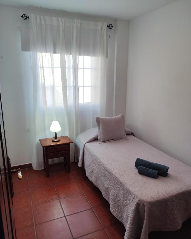 Postel nebo postele na pokoji v ubytování Apartamentos El Jablito