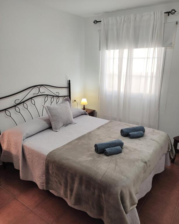 Postel nebo postele na pokoji v ubytování Apartamentos El Jablito