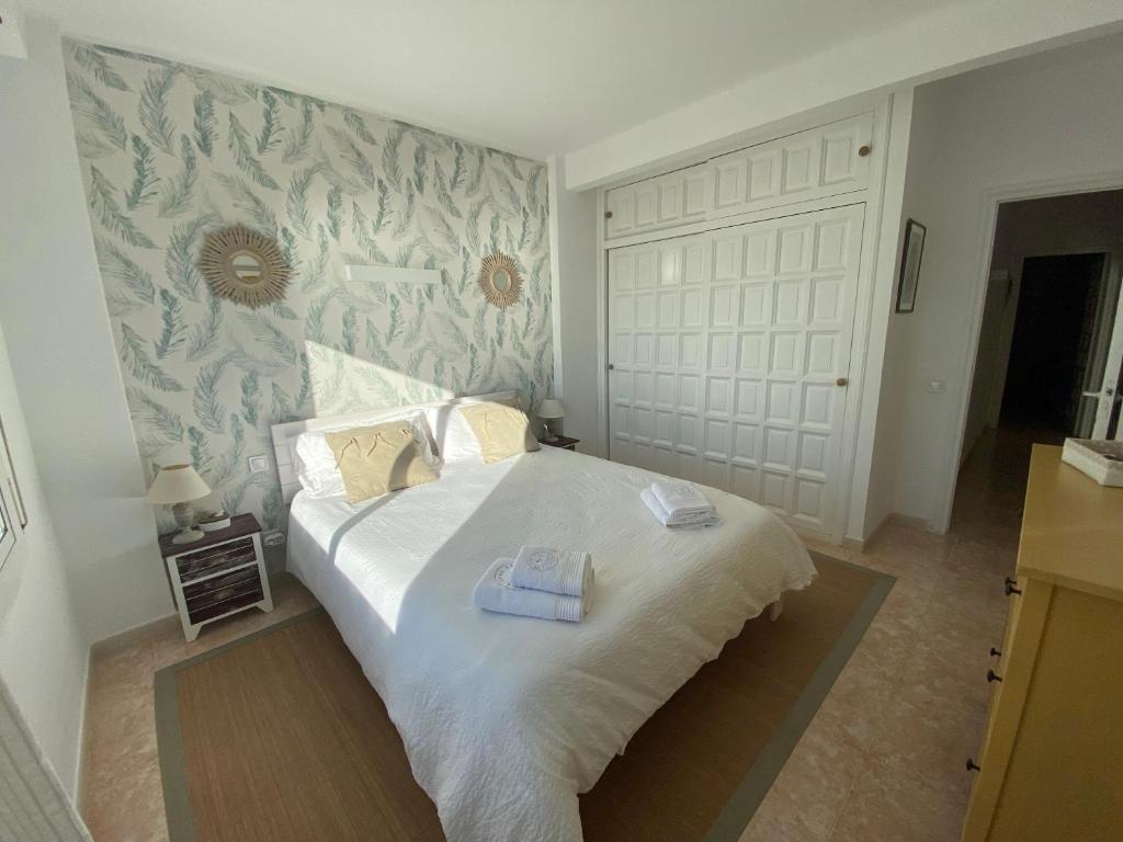 A bed or beds in a room at Casa 24