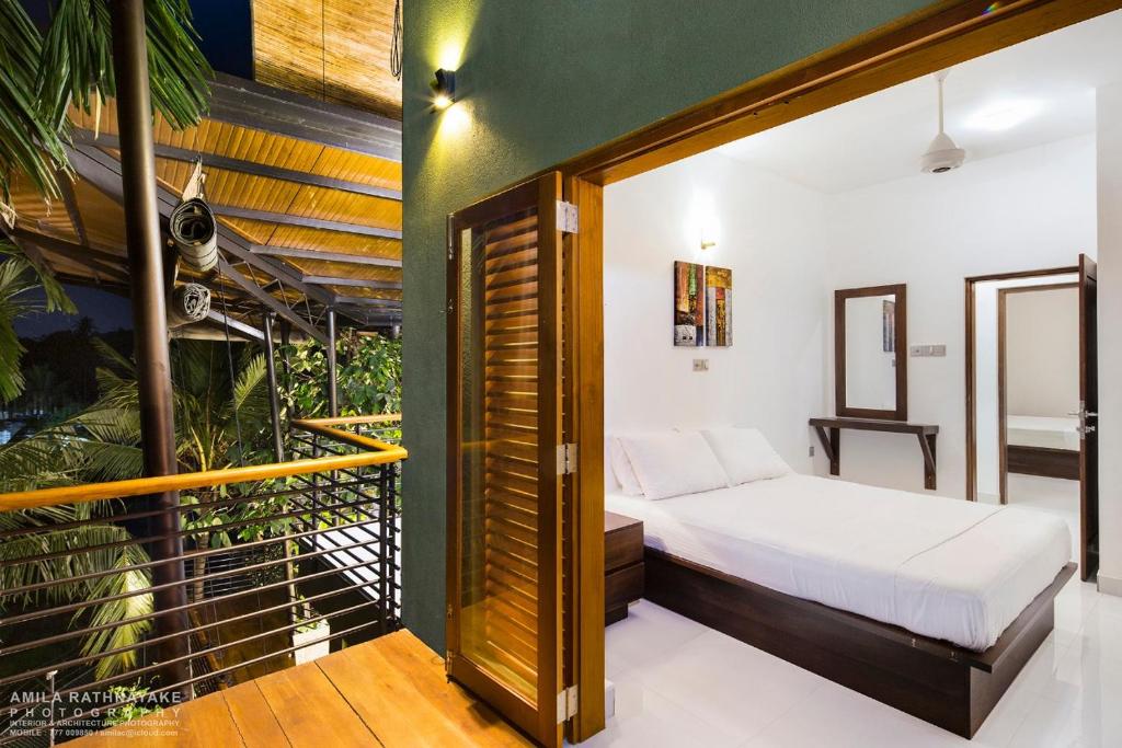 Villa 47 Colombo tesisinde bir odada yatak veya yataklar
