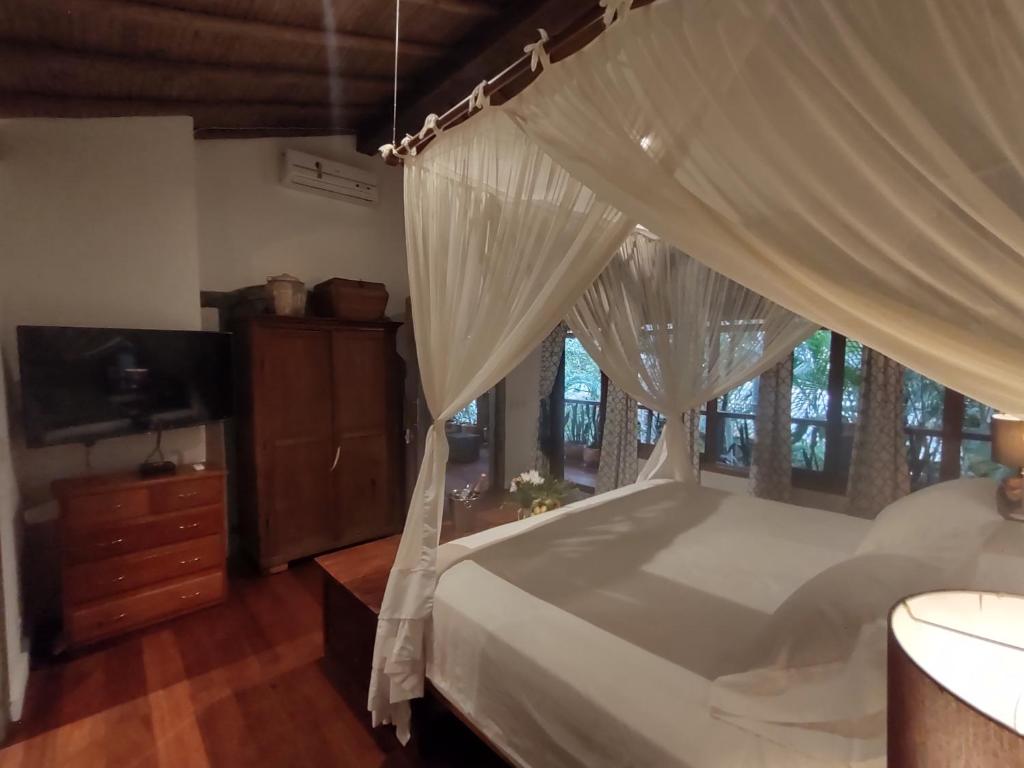 Postel nebo postele na pokoji v ubytování Monkey Casa Hotel