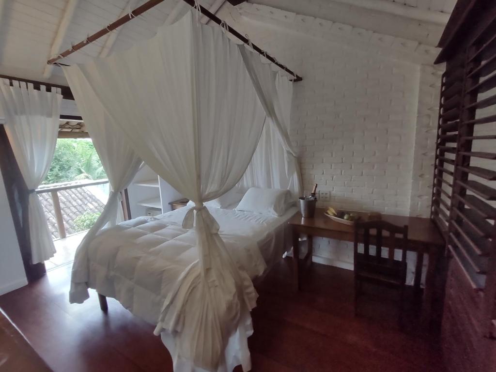 Postel nebo postele na pokoji v ubytování Monkey Casa Hotel