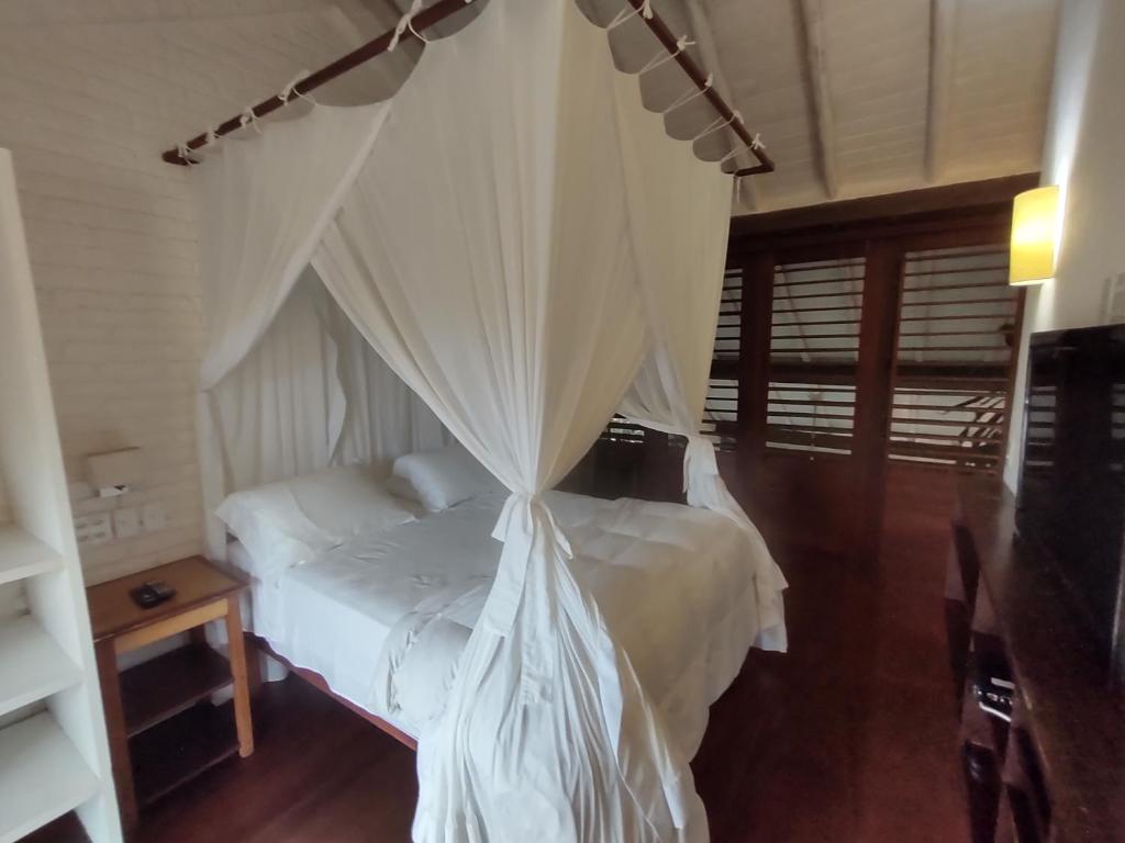 Postel nebo postele na pokoji v ubytování Monkey Casa Hotel