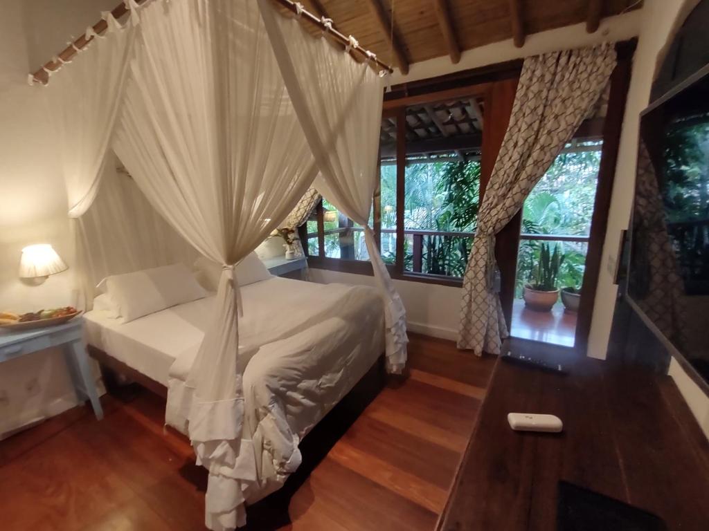 Postel nebo postele na pokoji v ubytování Monkey Casa Hotel