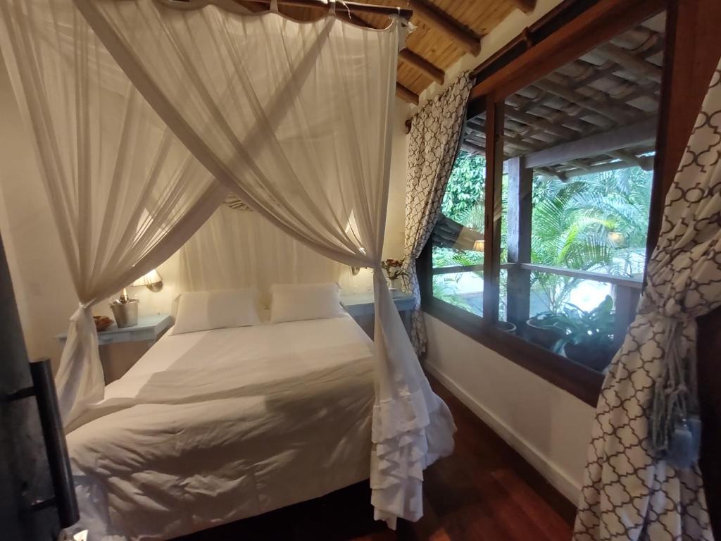 Postel nebo postele na pokoji v ubytování Monkey Casa Hotel
