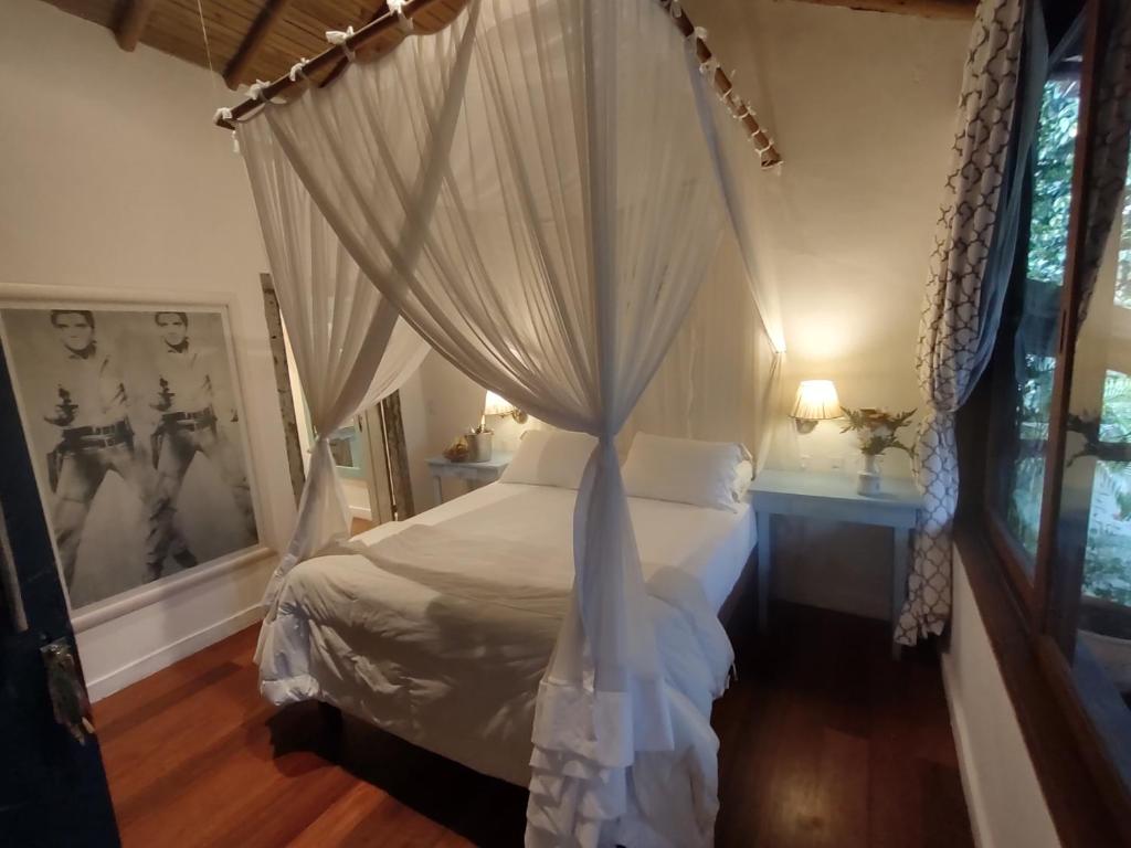 Postel nebo postele na pokoji v ubytování Monkey Casa Hotel