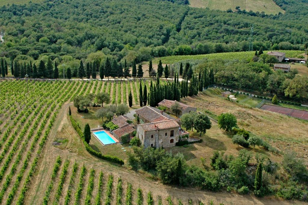 an aerial view of a house in a vineyard at Private Chianti Hill Residence in Vagliagli