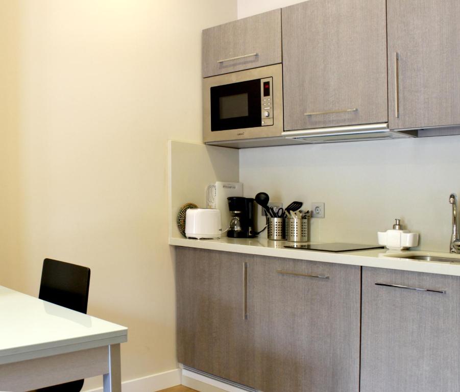Kuchyňa alebo kuchynka v ubytovaní SEVITUR Seville Comfort Apartments