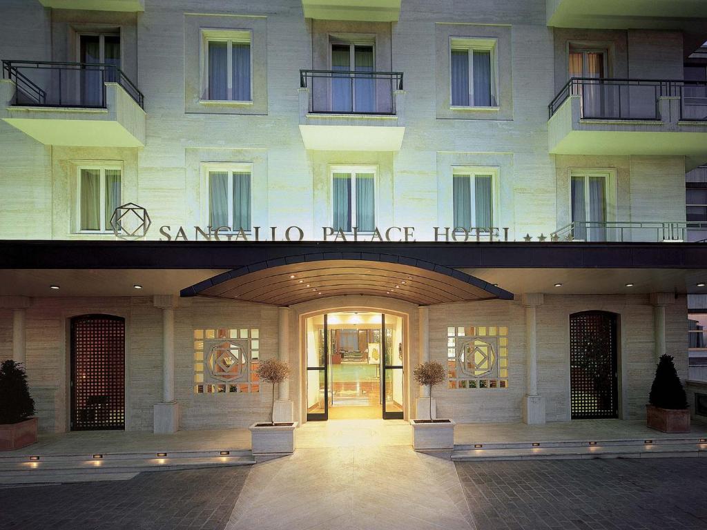 a building with an entrance with a sign on it at Sangallo Palace in Perugia