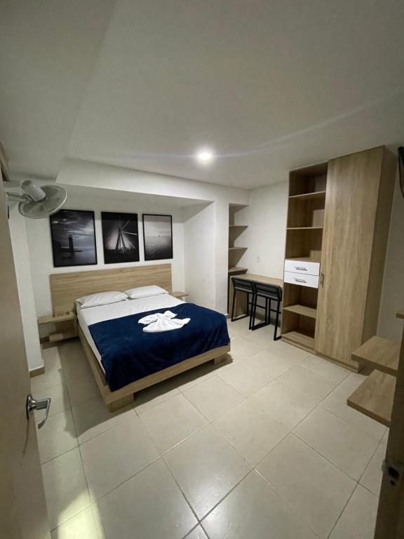 Postel nebo postele na pokoji v ubytování HOTEL MEDELLIN CENTRAL