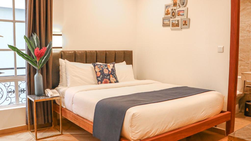 Un ou plusieurs lits dans un hébergement de l'établissement Mettavary Hotel