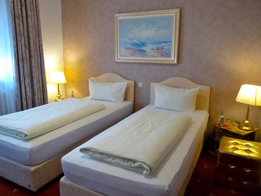 Postel nebo postele na pokoji v ubytování Hotel Geissler
