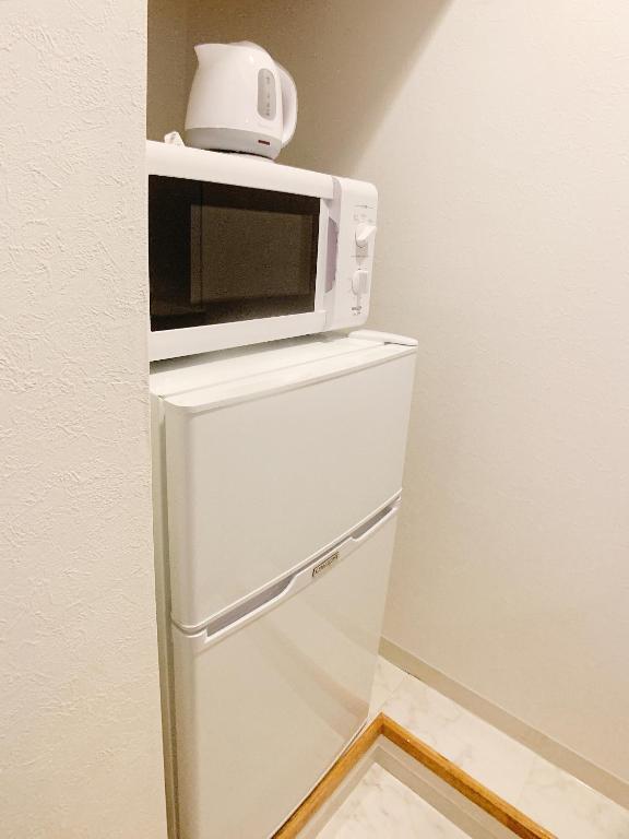 Kuchyň nebo kuchyňský kout v ubytování OUCHI HOTEL Fujimi