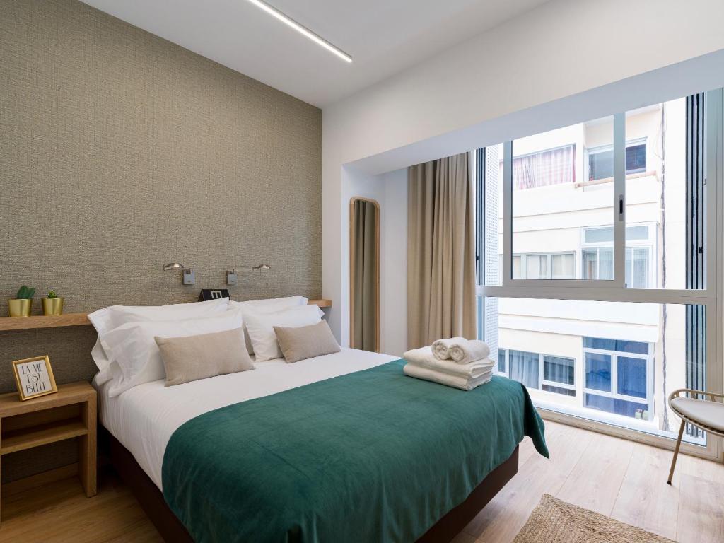 Postel nebo postele na pokoji v ubytování Hotel Emeté & Coworking by airnest