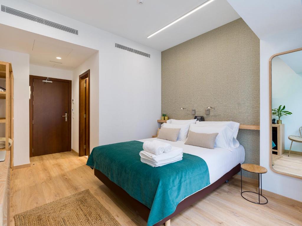 Postel nebo postele na pokoji v ubytování Hotel Emeté & Coworking by airnest