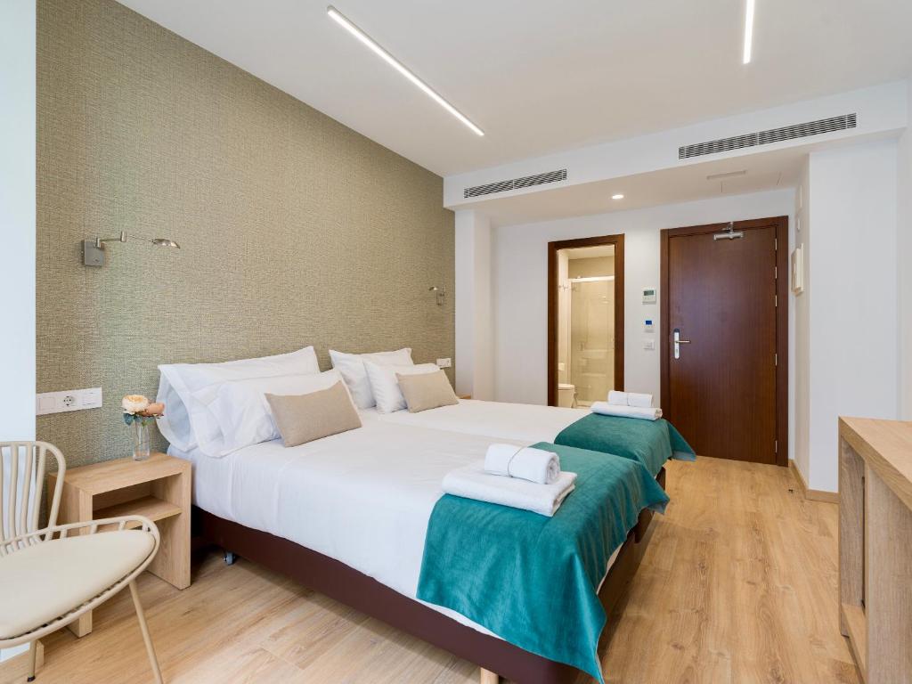 Postel nebo postele na pokoji v ubytování Hotel Emeté & Coworking by airnest