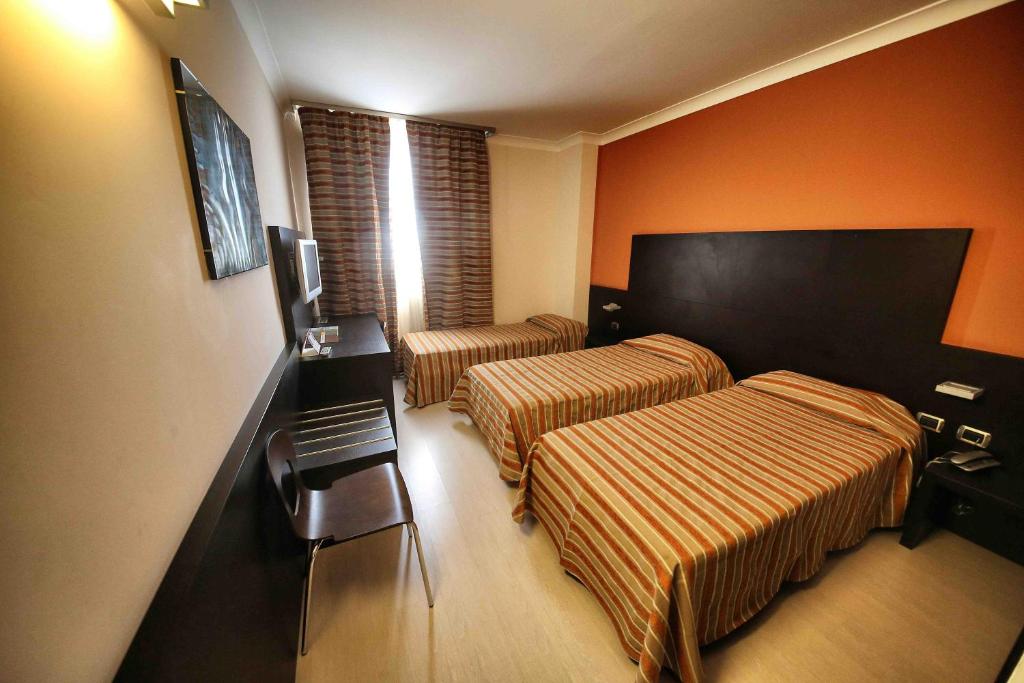 TV a/nebo společenská místnost v ubytování Vercelli Palace Hotel