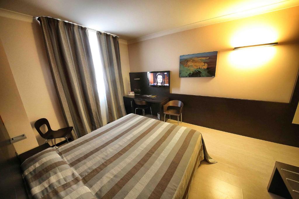 TV a/nebo společenská místnost v ubytování Vercelli Palace Hotel