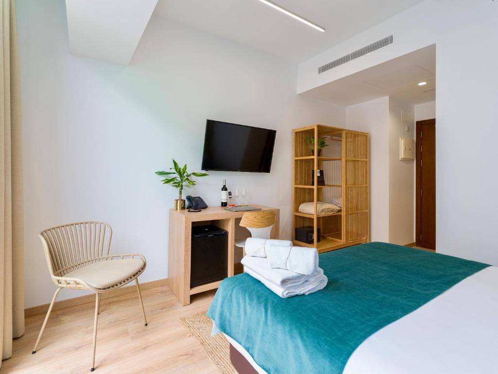 Postel nebo postele na pokoji v ubytování Hotel Emeté & Coworking by airnest