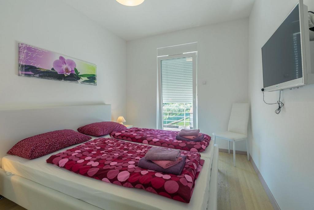 Łóżko lub łóżka w pokoju w obiekcie Villa Štefanja