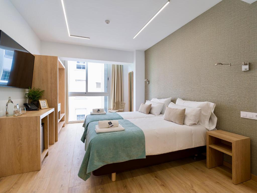 Postel nebo postele na pokoji v ubytování Hotel Emeté & Coworking by airnest