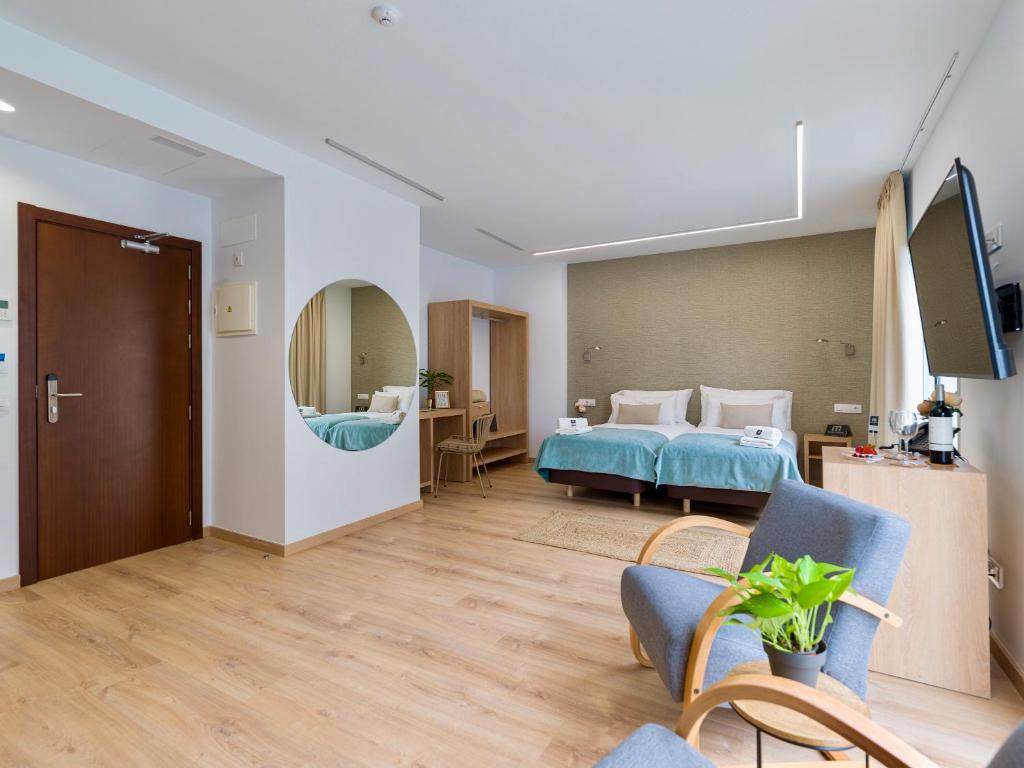 Postel nebo postele na pokoji v ubytování Hotel Emeté & Coworking by airnest