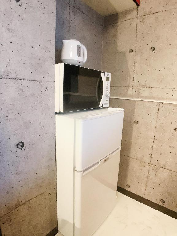 Kuchyň nebo kuchyňský kout v ubytování OUCHI HOTEL Fujimi