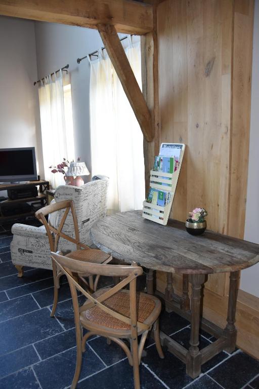 TV a/nebo společenská místnost v ubytování B&B Hoeve Ransberg